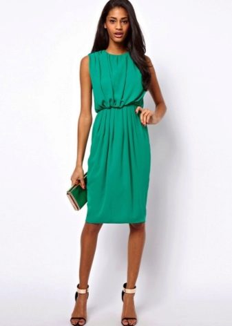 Fitted dress with a free cut for a figure Slim column