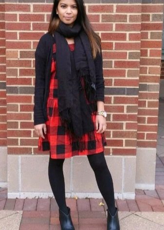 Black accessories for a dress in a red and black cage