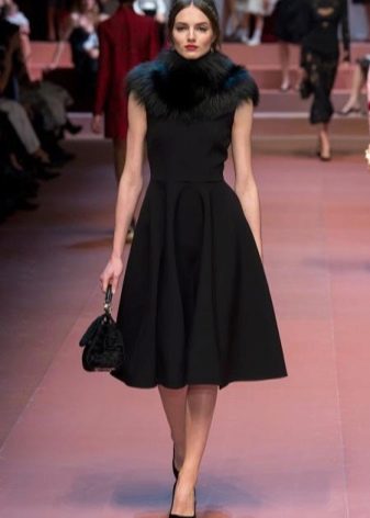 Fashionable dress for the fall-winter 2016 season with a fur collar