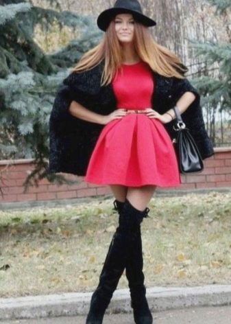 Short fluffy skirt combined with over the knee boots