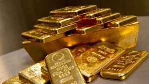 How much does an ounce of gold weigh and where is it applied?