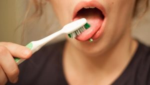 How do I clean my tongue?