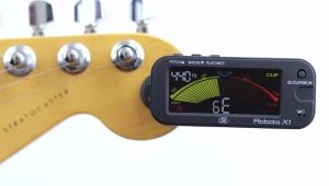 Tuning a guitar by a tuner