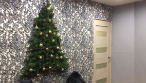 Tinsel Christmas trees on the wall