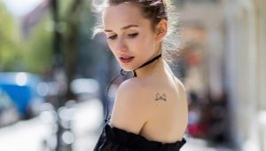 All about the tattoo on the shoulder blades