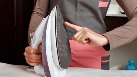 How do I clean burnt-on fabrics from my Teflon iron?
