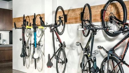 Bicycle mounts on the wall: types, tips for choosing and installing