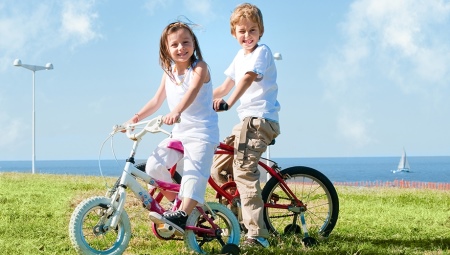 From what age can you ride a bike on the road and what rules must be followed?