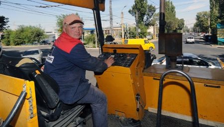 Who is an asphalt paver driver and what does he do?