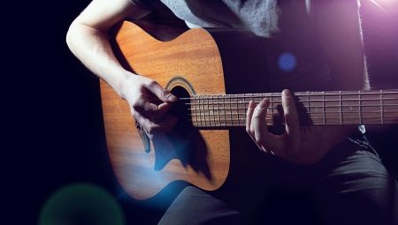 Playing acoustic guitar