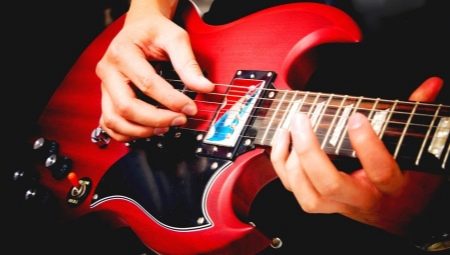 How do I connect an electric guitar to my computer and play it?