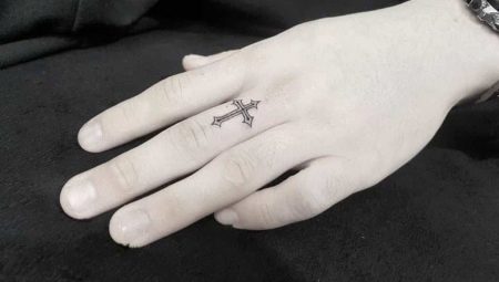Tattoo in the form of a cross on the fingers: meaning and varieties
