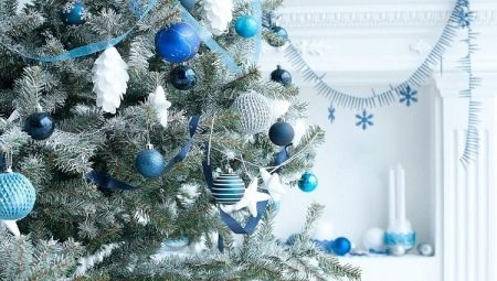 Decorating the Christmas tree in blue-silver color