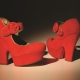 Red suede pumps