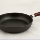 How to clean a cast iron pan from carbon deposits at home?