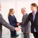 Who should be the first to say hello according to etiquette?