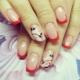 Red jacket on nails: choice of shade and combination of colors