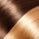How is bleaching of dark hair achieved?