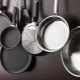 How do I prepare a new pan for use?