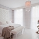 White curtains in the interior of the bedroom