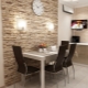 Wall decoration options near the table in the kitchen
