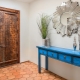 Where can you place a mirror in the hallway?