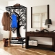 Wrought iron hangers in the hallway: varieties and tips for selection