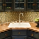 Kitchens with a sink in the corner: pros and cons, examples in the interior