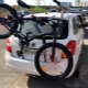 Bicycle rack for the rear door of the car: features and choices