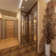 Decorative stone in the hallway: features and finishing methods