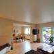 Stretch single-level ceilings for the hall: pros and cons, varieties, choices, examples