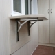Folding tables on the balcony: varieties, tips for choosing and installing