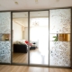 Sliding wardrobes in the entire wall in the living room: what are they and how to choose?