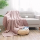 Choosing a fashionable blanket on the sofa