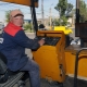 Who is an asphalt paver driver and what does he do?