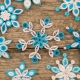 How to make snowflakes using the quilling technique?