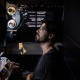 Who is a projectionist and what does he do?