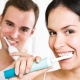 How do I brush my teeth with an electric toothbrush?