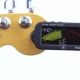 Tuning a guitar by a tuner