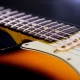 Why are my guitar strings rattling and how to fix the problem?