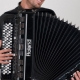 What is the difference between a button accordion and an accordion?