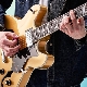 What is a fifth and how do they play the guitar?
