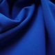 What is a crepe suit fabric and where is it used?