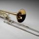 What are trombones and how are they played?