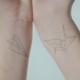 What does the paper airplane tattoo mean?
