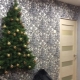 Tinsel Christmas trees on the wall