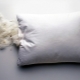 How do I clean and wash my feather pillow?