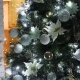 How to decorate a Christmas tree with silver toys?