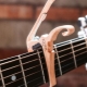 Capo for guitar: purpose and features of choice