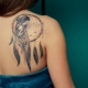 Tattoo on shoulder blades for girls